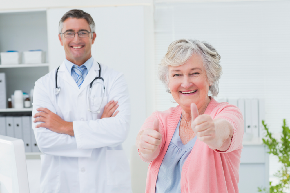 Doctor and Patient Giving A Thumbs Up Sign