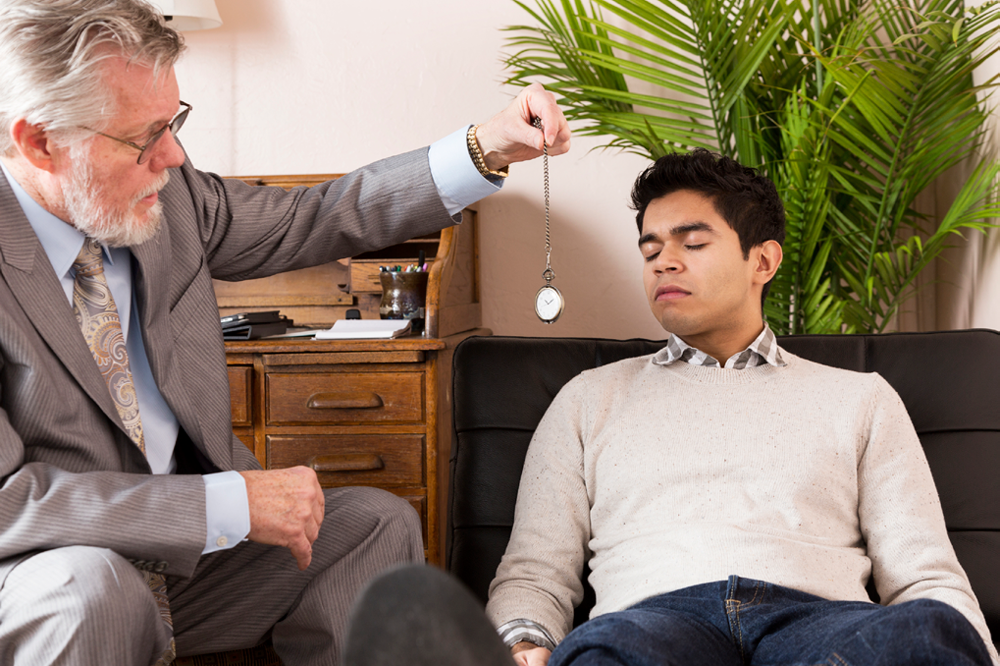 Man Being Hypnotized By A Hypnotherapist